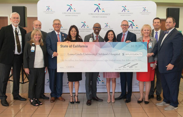 At Loma Linda University Medical Center and Children’s Hospital to present the hospital with a check for $55 million